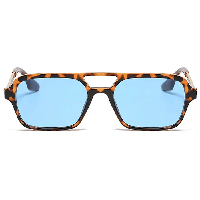 Unisex cat-eye tinted sunglasses worn outdoors in contemporary style by Crown Eyewear