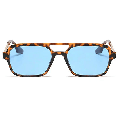 Unisex cat-eye tinted sunglasses worn outdoors in contemporary style by Crown Eyewear